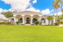 Step into refined living with this spacious executive retreat for sale in Port Orange Florida Volusia County County on GolfHomes.com