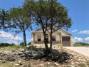 Welcome to 100 Glen Eagles Drive in the Cliffs Resort! Situated for sale in Possum Kingdom Lake Texas Palo Pinto County County on GolfHomes.com