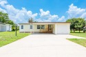 Super-rare, 3 bed/2 bath with garage AND carport on golf course for sale in Davenport Florida Polk County County on GolfHomes.com