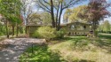 Perched atop one of the highest elevations in North Oaks, this for sale in North Oaks Minnesota Ramsey County County on GolfHomes.com