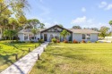 Canal-front gem is a rare find that promises the lifestyle for sale in New Smyrna Beach Florida Volusia County County on GolfHomes.com