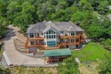 Experience breathtaking Table Rock Lake living in this for sale in Holiday Island Arkansas Carroll County County on GolfHomes.com
