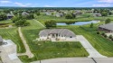 This magnificent home sits valiantly upon a one acre lot for sale in Augusta Kansas Butler County County on GolfHomes.com