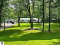 Let nature wrap her arms around you in this very spacious four for sale in Bellaire Michigan Antrim County County on GolfHomes.com