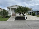 Nestled in the sought-after Lakes at Countrywood 55+ community for sale in Plant City Florida Hillsborough County County on GolfHomes.com