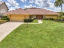 Discover sweeping golf course and lake views at this serene for sale in Palm Beach Gardens Florida Palm Beach County County on GolfHomes.com