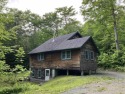 THIS IS IT! Tri-level 3 bedroom, 2 bath chalet tucked away off for sale in Wilmington Vermont Windham County County on GolfHomes.com