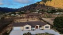 Nestled on a scenic hilltop, this exquisite 2024-built home for sale in Waianae Hawaii Oahu  County County on GolfHomes.com