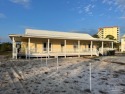 This is Perdido Key's most quintessential waterfront cottage for sale in Pensacola Florida Escambia County County on GolfHomes.com