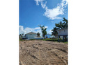 This Estero Island property boasts attractive owner financing for sale in Fort Myers Beach Florida Lee County County on GolfHomes.com