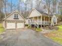 Step into serenity and style in this stunning craftsman-style for sale in Ellijay Georgia Gilmer County County on GolfHomes.com