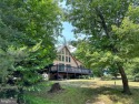Welcome to your beautiful chalet home in The Woods!  This for sale in Hedgesville West Virginia Berkeley County County on GolfHomes.com