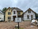 Classic architecture currently being built by Signature Homes by for sale in Suwanee Georgia Gwinnett County County on GolfHomes.com