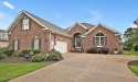 Enjoy serene pond views with this stunning brick home located in for sale in Leland North Carolina Brunswick County County on GolfHomes.com