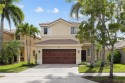Beautifully maintained 5 bed, 2.5 bath home in the guard-gated for sale in Weston Florida Broward County County on GolfHomes.com