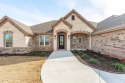 Welcome to your dream home in the highly sought-after gated for sale in Granbury Texas Hood County County on GolfHomes.com