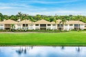 Spectacular lake and lush double fairway views from this 1st for sale in Boynton Beach Florida Palm Beach County County on GolfHomes.com