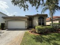 Gorgeous single-story Mediterranean-style pool home in the gated for sale in Coral Springs Florida Broward County County on GolfHomes.com