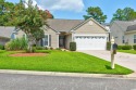 Welcome in to this meticulously maintained single-level home for sale in Murrells Inlet South Carolina Horry County County on GolfHomes.com