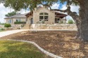 Immaculately kept limestone rock home that is listed perfectly for sale in Kerrville Texas Kerr County County on GolfHomes.com