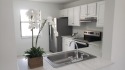 Newly painted, spacious corner unit 2/2 condo with water views for sale in Royal Palm Beach Florida Palm Beach County County on GolfHomes.com