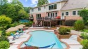 Nestled on a private, one-acre lot just moments from Highway 400 for sale in Atlanta Georgia Fulton County County on GolfHomes.com