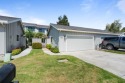 Light-filled townhouse featuring a kitchen with granite counters for sale in Hollister California San Benito County County on GolfHomes.com