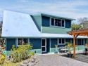 Situated in the lush serenity of Volcano Golf Course for sale in Volcano Hawaii Big Island County County on GolfHomes.com