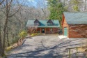 Located in Lake Toxaway Estates, this stunning log home offers for sale in Lake Toxaway North Carolina Transylvania County County on GolfHomes.com