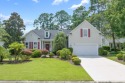 Lush landscaping surrounds this 4-bedroom (One bedroom is for sale in Pawleys Island South Carolina Georgetown County County on GolfHomes.com