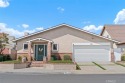 Beautifully maintained home with approx. 1,765 sq. ft. backing for sale in Cypress California Orange County County on GolfHomes.com
