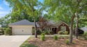 Located in a desirable golf course community, this spacious, Georgia