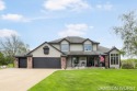 Overlooking the serene 2nd hole at the prestigious Railside Golf for sale in Byron Center Michigan Kent County County on GolfHomes.com