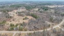 Discover pure tranquility on this stunning, partially wooded lot for sale in Nekoosa Wisconsin Adams County County on GolfHomes.com