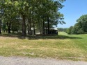Highly coveted shady lot on 16th tee box. Sit out on your back for sale in Holiday Island Arkansas Carroll County County on GolfHomes.com