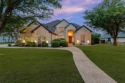 Luxury meets lake life in Eagle Chase at Tanglewood, a gated for sale in Pottsboro Texas Grayson County County on GolfHomes.com