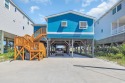 You MUST SEE this OCEANFRONT, raised beach home! A place where for sale in Garden City Beach South Carolina Georgetown County County on GolfHomes.com
