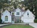 Discover a meticulously designed home that seamlessly blends for sale in Suwanee Georgia Forsyth County County on GolfHomes.com