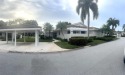 This Stunning wide golf course view 2/2 updated Villa overlooks for sale in Jupiter Florida Palm Beach County County on GolfHomes.com