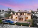 Cradled by the Red Rock Mountains, this exceptional estate for sale in Las Vegas Nevada Clark County County on GolfHomes.com