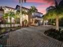 Welcome to this luxurious 5-bedroom, 5-bathroom home in the for sale in Parkland Florida Broward County County on GolfHomes.com