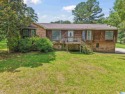 Nestled on a spacious lot alongside the golf course, this home for sale in Pinson Alabama Jefferson County County on GolfHomes.com