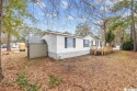 MOTIVATED SELLER - Welcome to this spacious and charming for sale in Murrells Inlet South Carolina Horry County County on GolfHomes.com