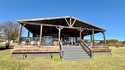 Discover exceptional lakeside living in this beautifully for sale in Quitman Texas Wood County County on GolfHomes.com