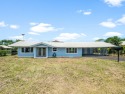 **LOCATION! LOCATION! LOCATION!** Discover this newly refreshed for sale in Hilo Hawaii Big Island County County on GolfHomes.com