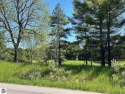 Beautiful, and lightly treed, lot overlooking the 4th fairway at for sale in Bellaire Michigan Antrim County County on GolfHomes.com