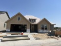 The Redwood by Berkeley Building Co. sitting on hole #7 of the for sale in Kuna Idaho Ada County County on GolfHomes.com