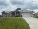 Welcome Home to this spacious 3/3 WITH A DEN and TILE THROUGHOUT for sale in Cape Coral Florida Lee County County on GolfHomes.com