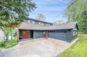 Enjoy breathtaking water views from this spacious 4-bedroom for sale in Canadian Lakes Michigan Mecosta County County on GolfHomes.com