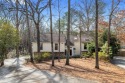 Tucked away in the peaceful Rivermont neighborhood, this for sale in Alpharetta Georgia Fulton County County on GolfHomes.com